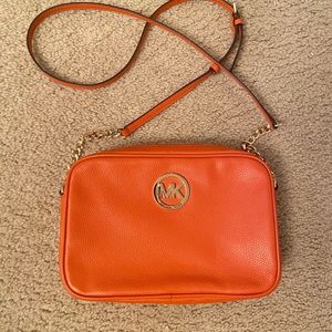 Orange Michael Kors crossbody purse